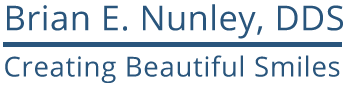 The image shows a logo for a dental practice with the name Brian E. Nunley, DDS in white text on a blue background at the top, followed by the words Creating Beautiful Smiles below in smaller font. Below the text is an illustration of a smiling face.